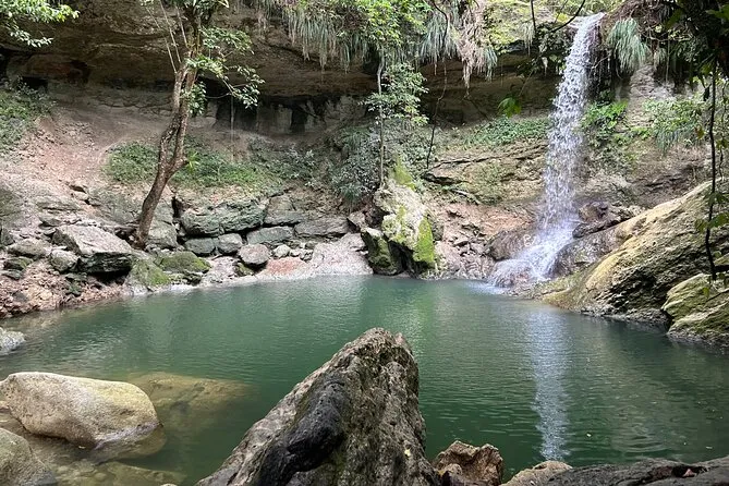 Group swimming at Gozalandia Waterfall on a guided tour in San Sebastián Puerto Rico